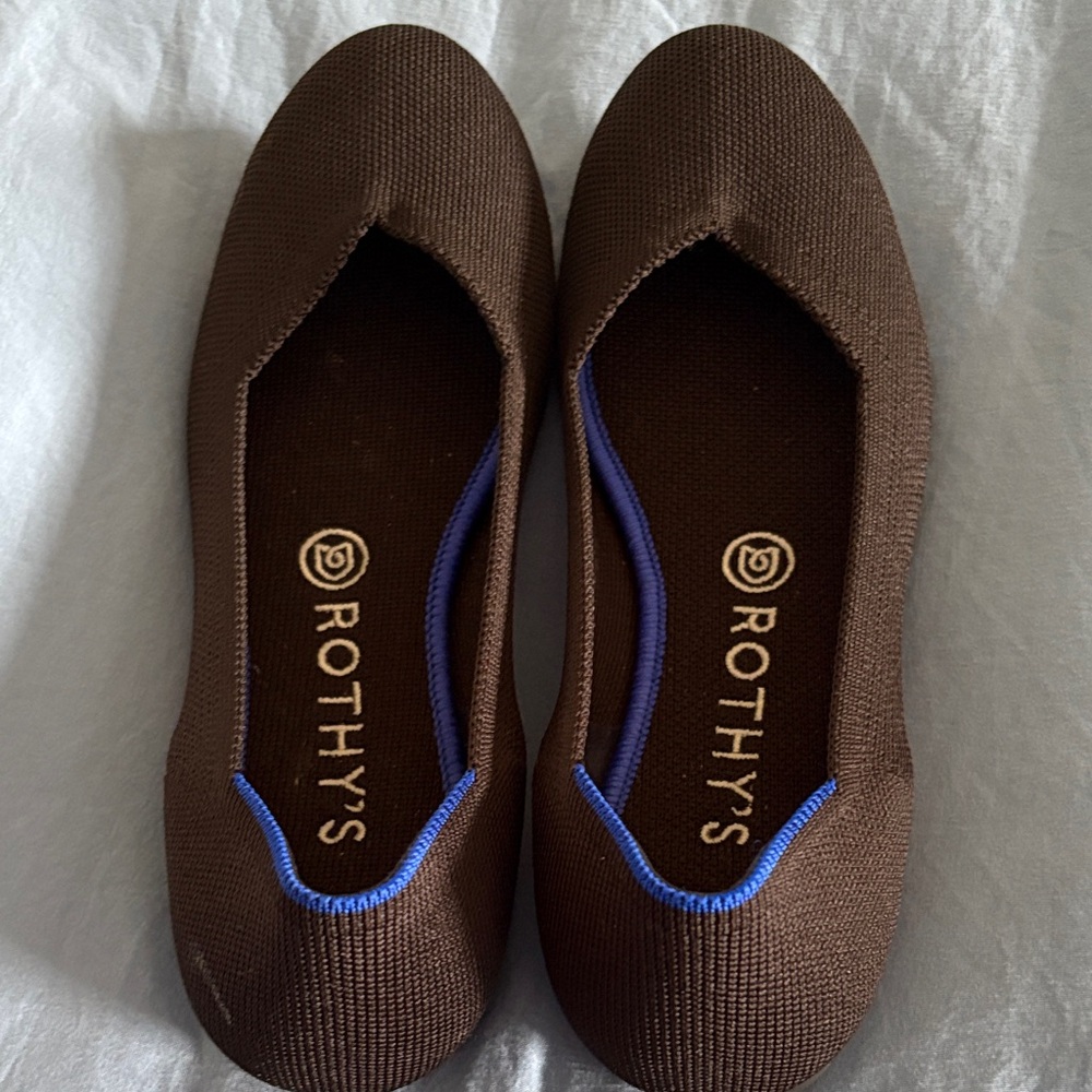 Rothy's black Flats with Blue Trim